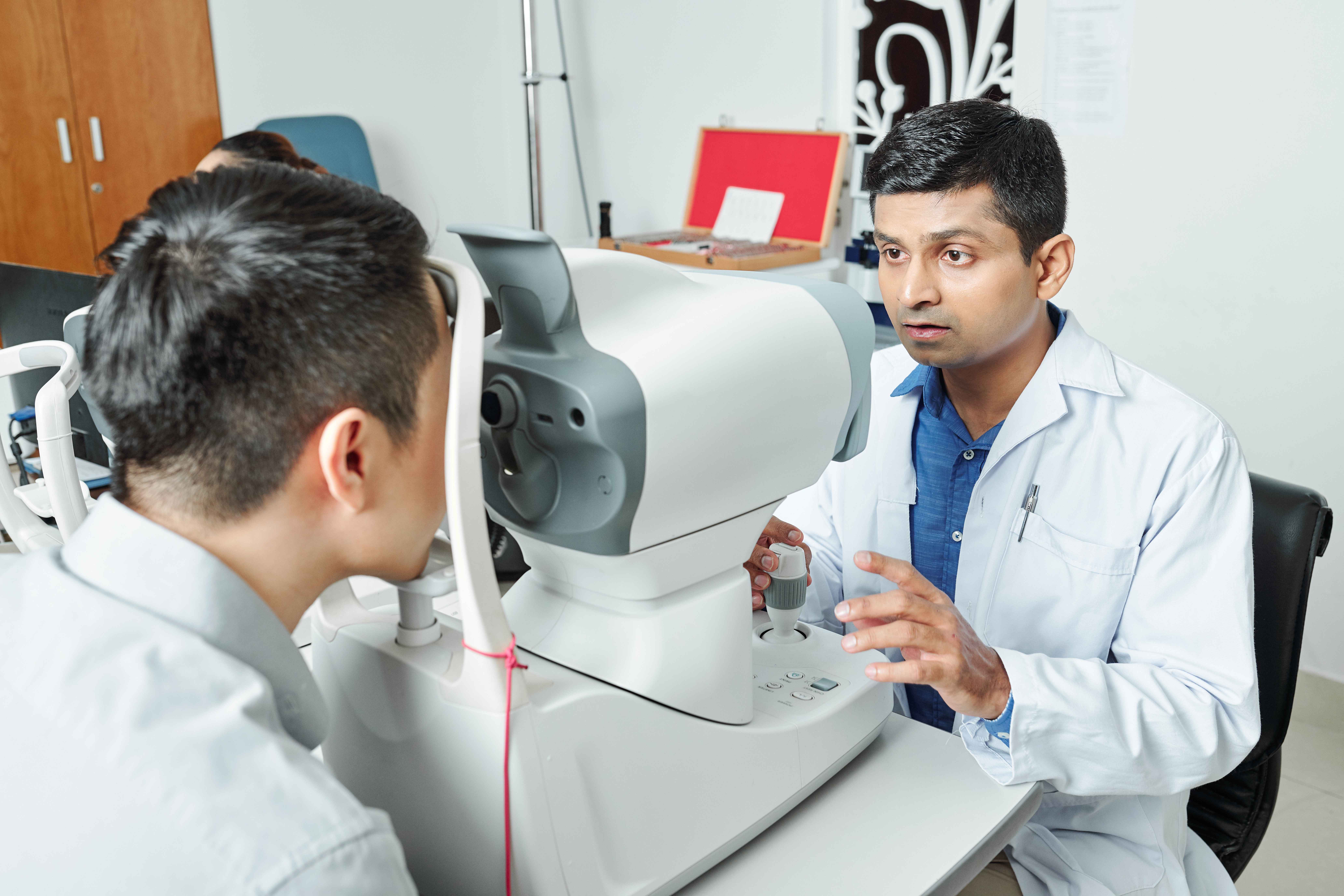 indian-ophthalmologist-examining-patient_11zon (1)